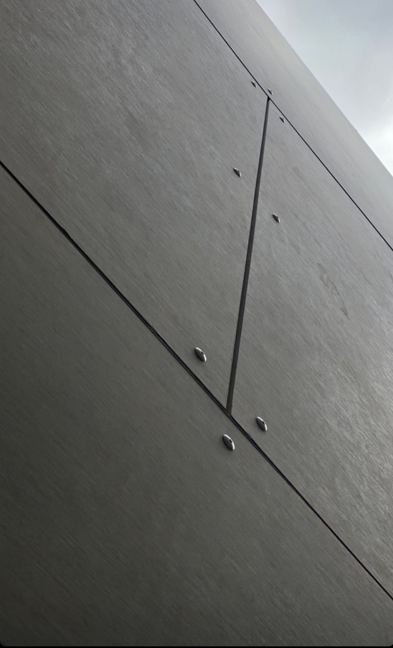 Close-up of Cemintel Barestone panels with expressed joints and visible fixings