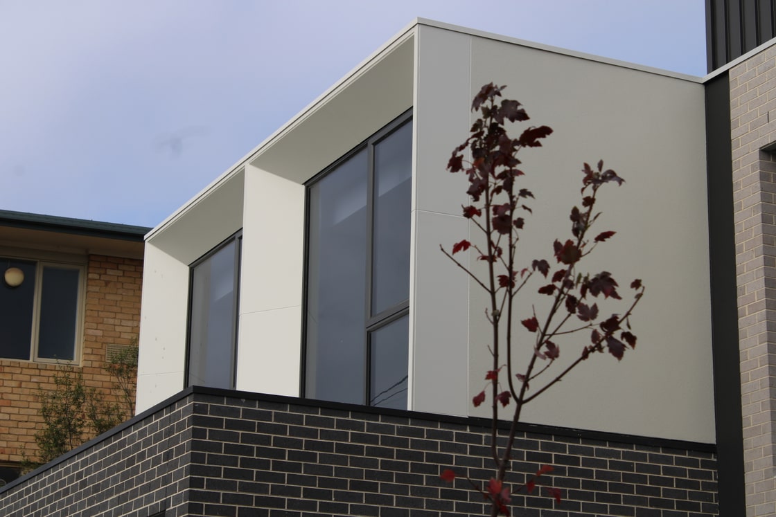 James Hardie Matrix panel cladding forming crisp corners and window surrounds