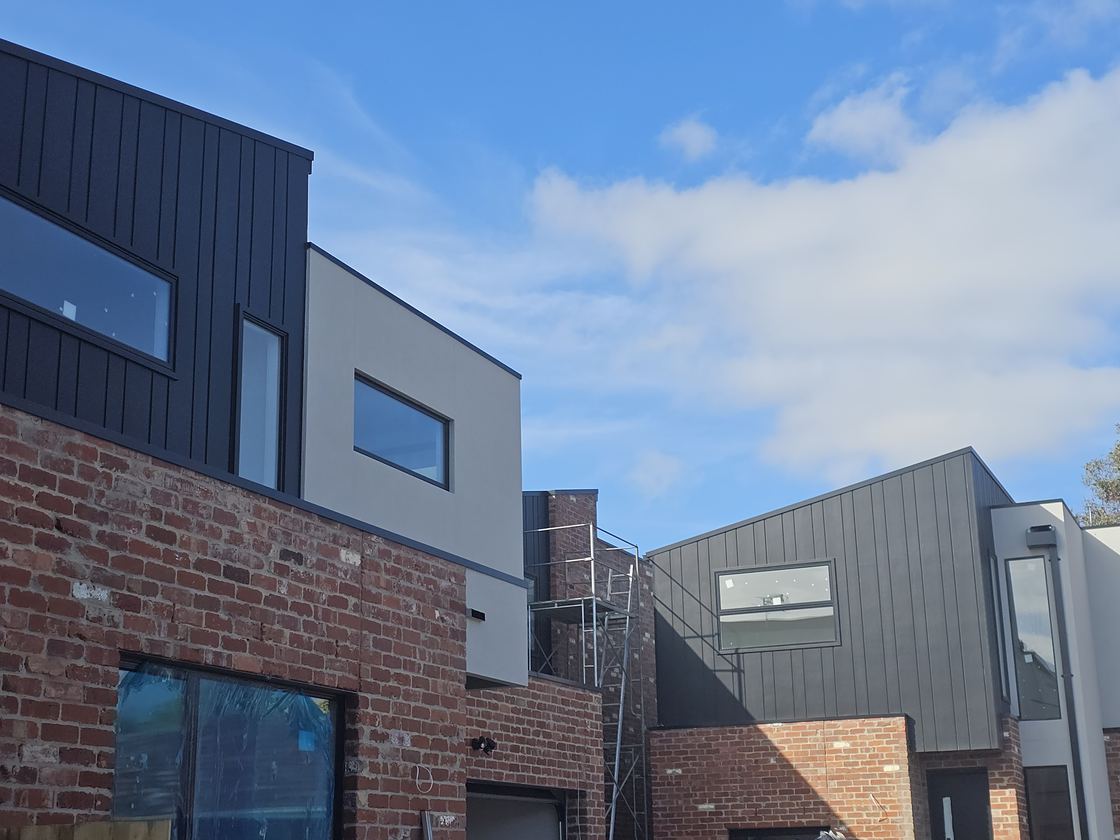 James Hardie Oblique cladding installed above recycled brick facade on a townhouse project
