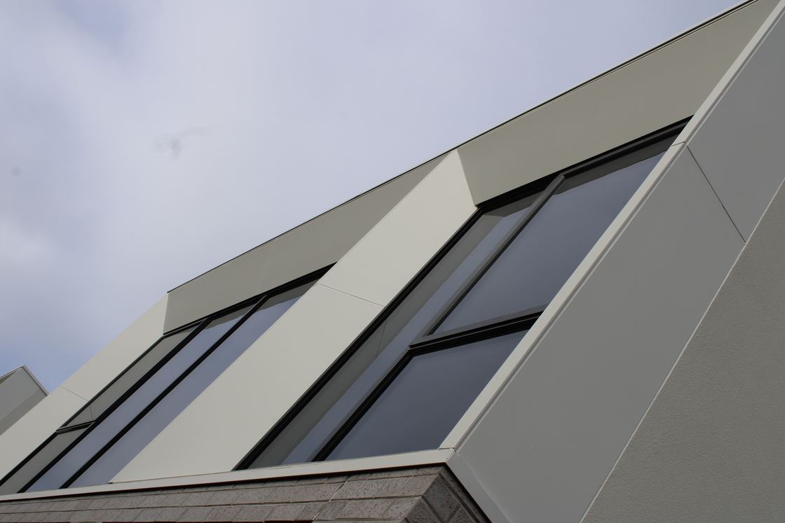 James Hardie Matrix cladding used for angled window surrounds and panel margins